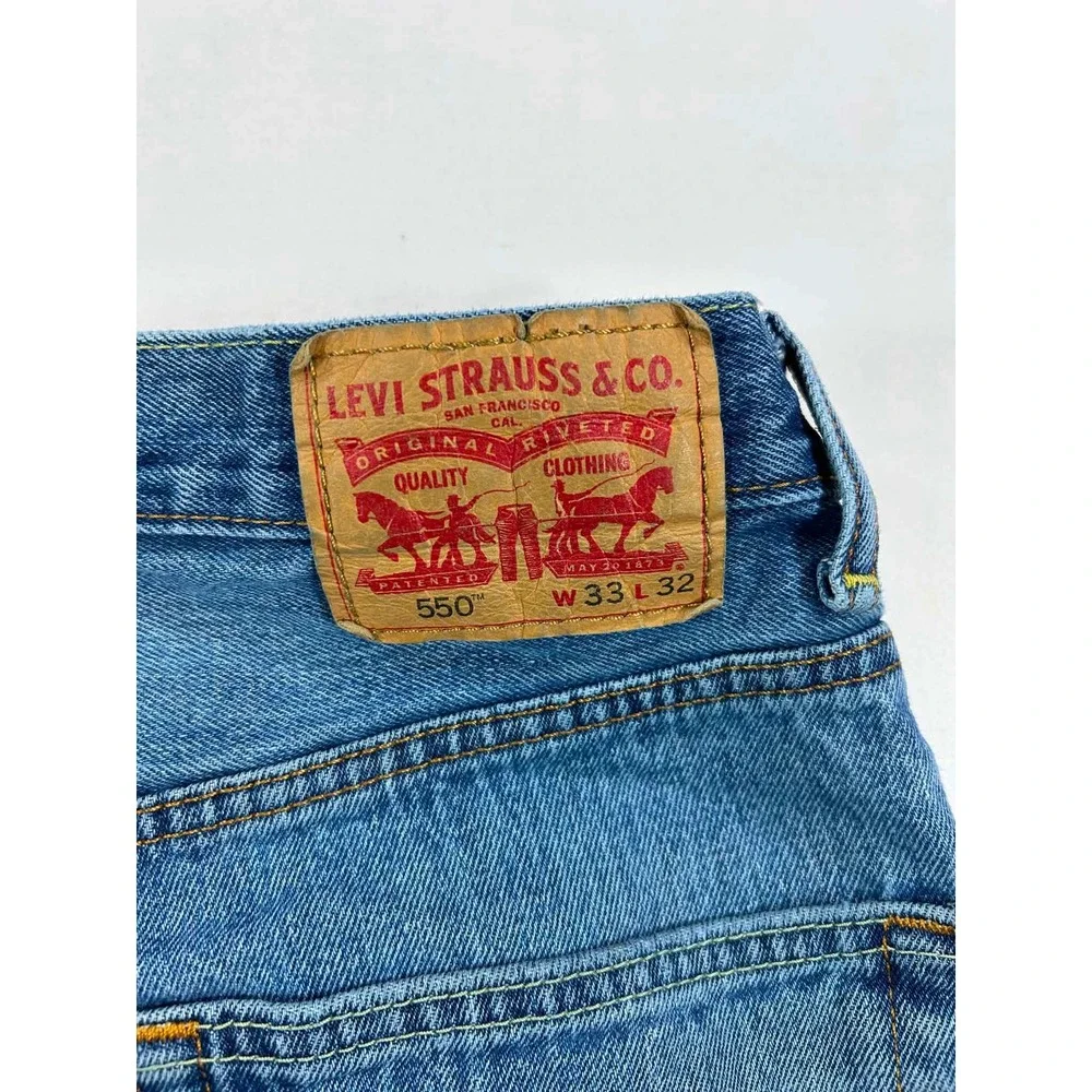 Levis 550 Relaxed Fit Tapered Leg Jeans Mens 33x32 Medium Blue Distressed Denim